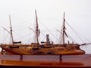  model ship with a wooden hull and a steam engine, on a wooden base with a plaque