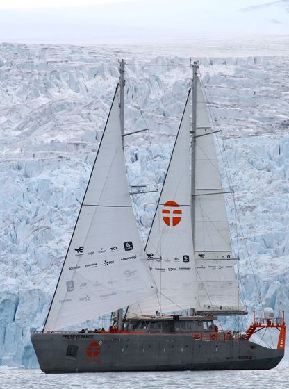Schooner Persévérance of Jean-Louis Étienne sailing in front of an ice wall during the Arctic expedition.